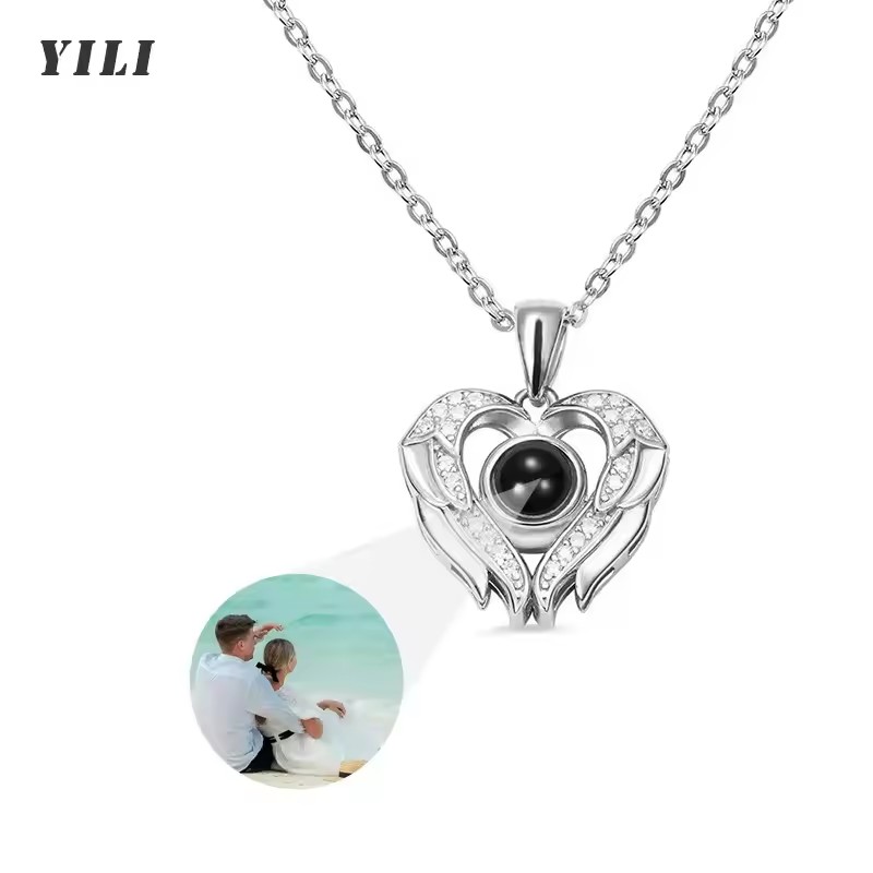 Winged heart pendant with photo projection crystal